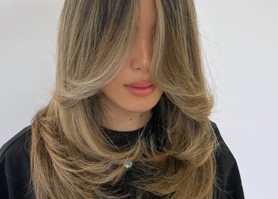 Blonde layered hairstyle at Estrella Salon, San Diego, California, US.