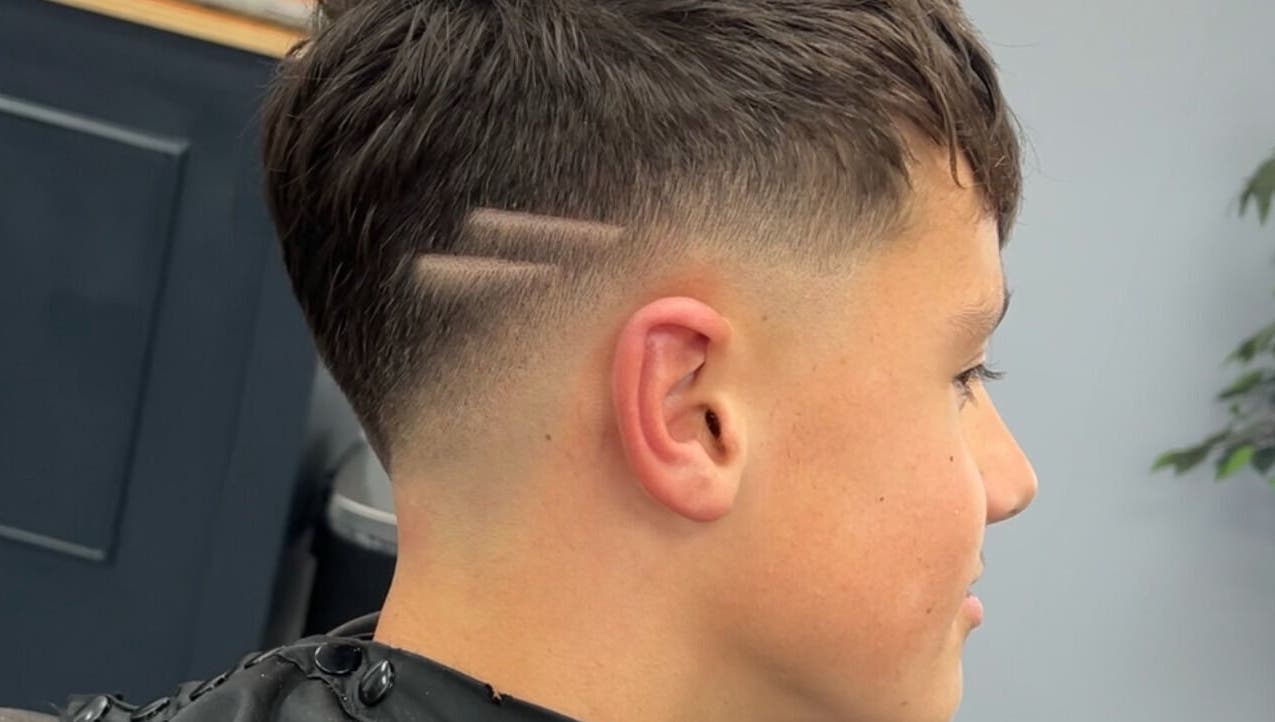 Close-up of a modern haircut with two lines at Eydmanns Barbering, Bognor Regis, England, GB.