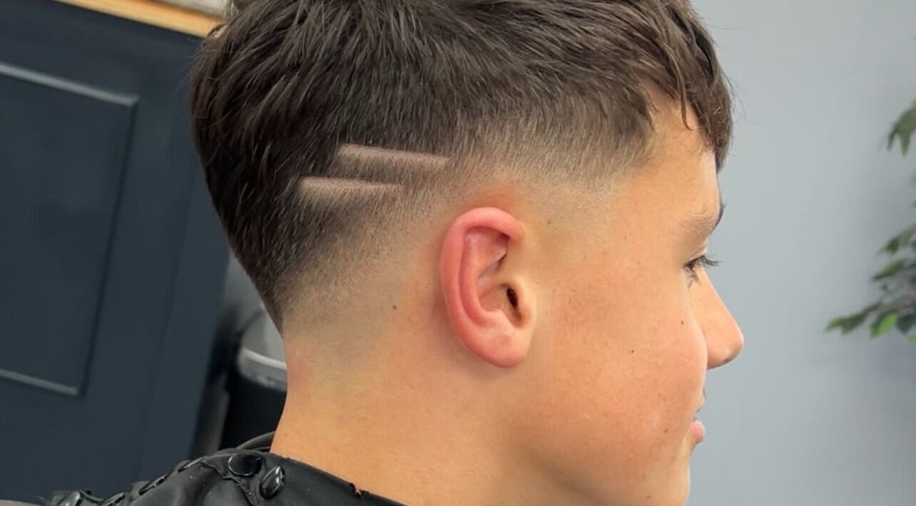 Close-up of a modern haircut with two lines at Eydmanns Barbering, Bognor Regis, England, GB.