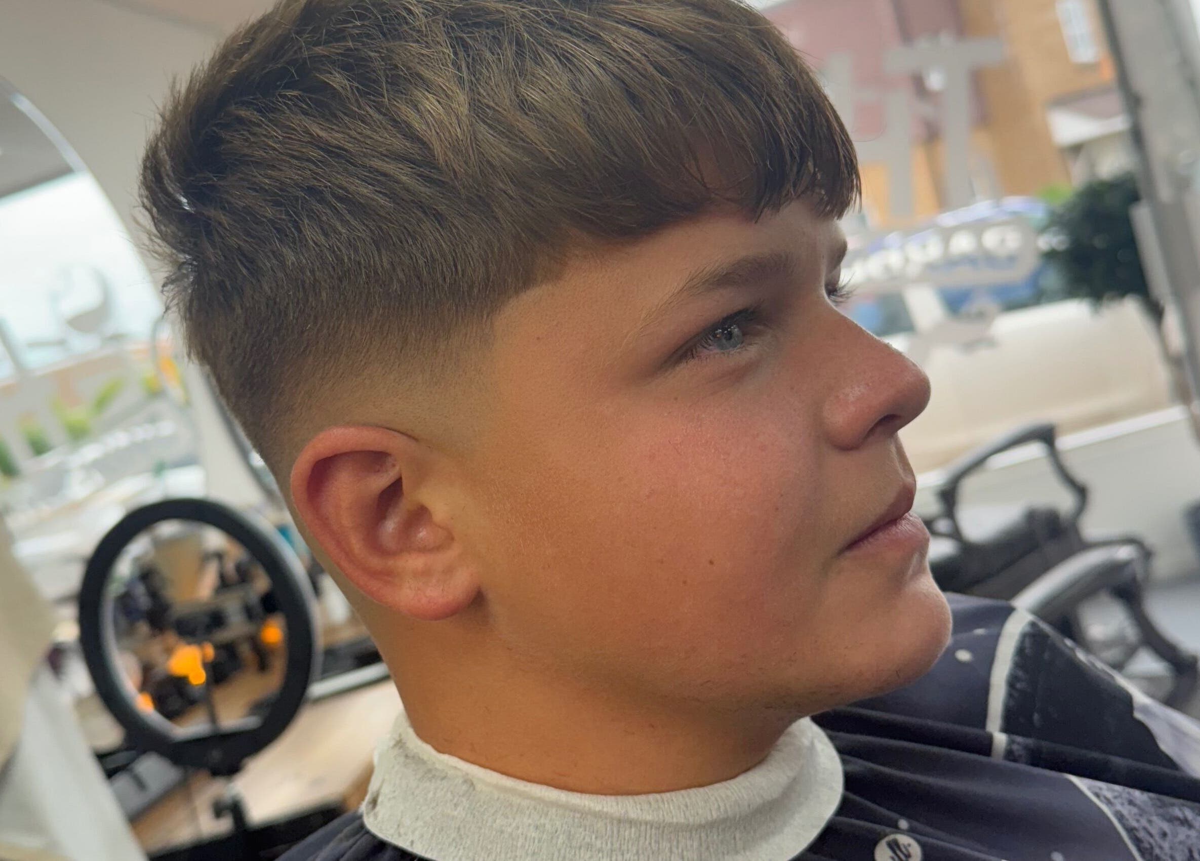Young man with a fresh fade haircut at Eydmanns Barbering in Bognor Regis, England, GB.