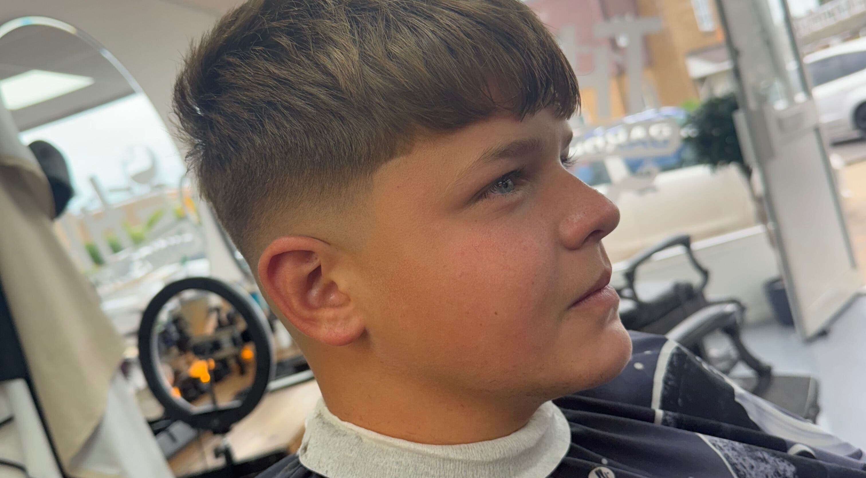 Young man with a fresh fade haircut at Eydmanns Barbering in Bognor Regis, England, GB.