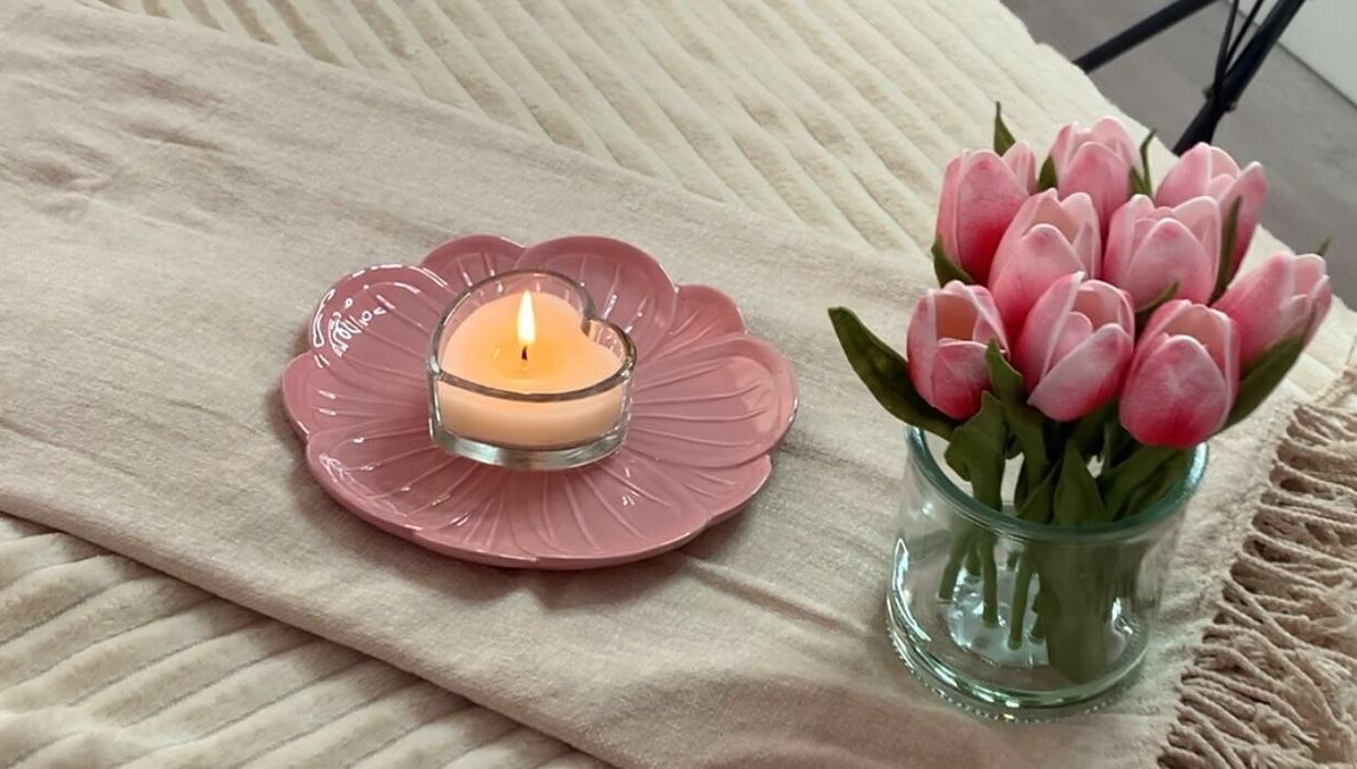 Cozy candle and tulips setting at Skin Luminosity by Lydia in Southend on Sea, England, GB.