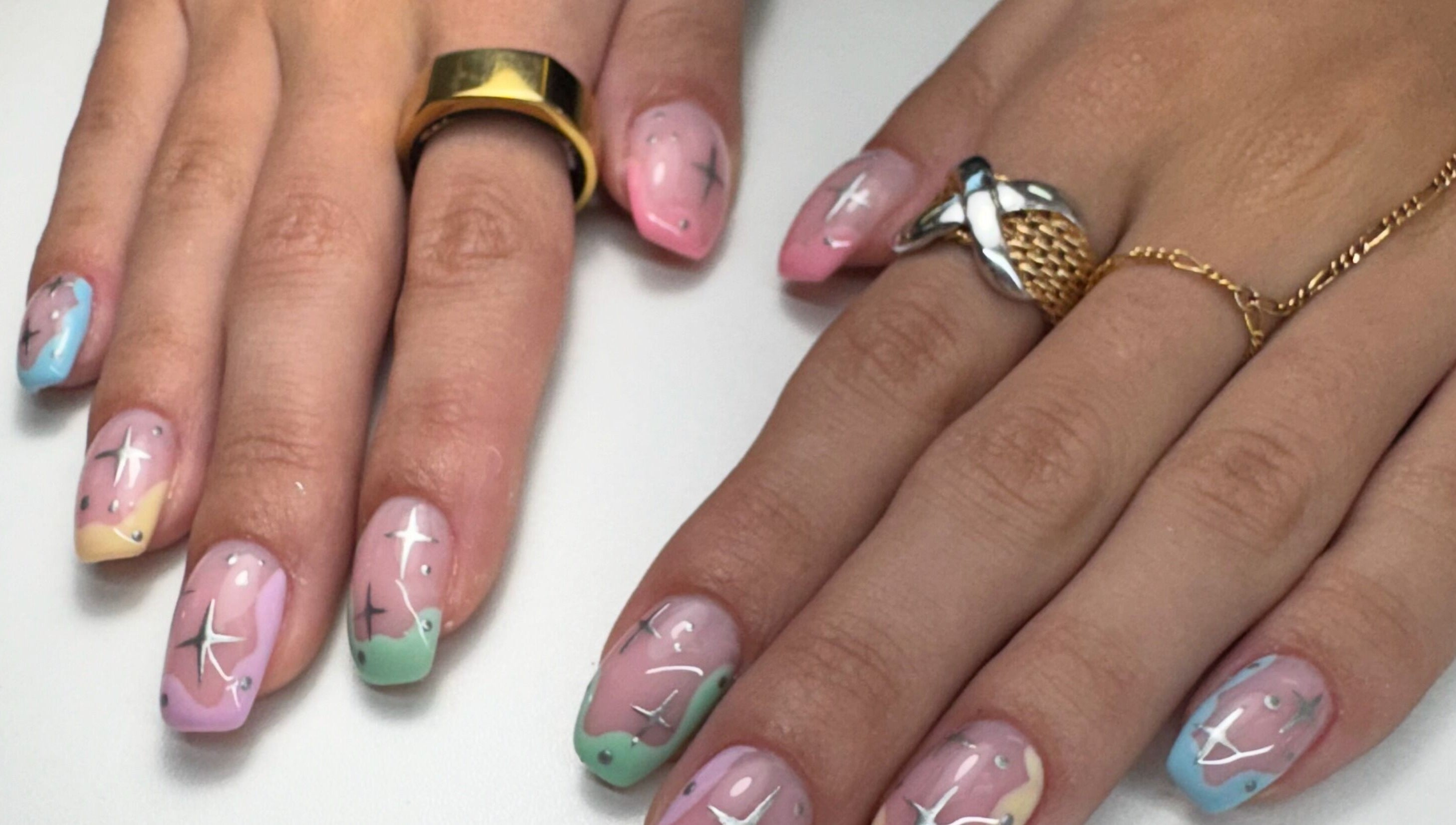 Celestial themed nail art at Alana Bee Nails, Margate, Florida. Featuring pastel colors and star designs.