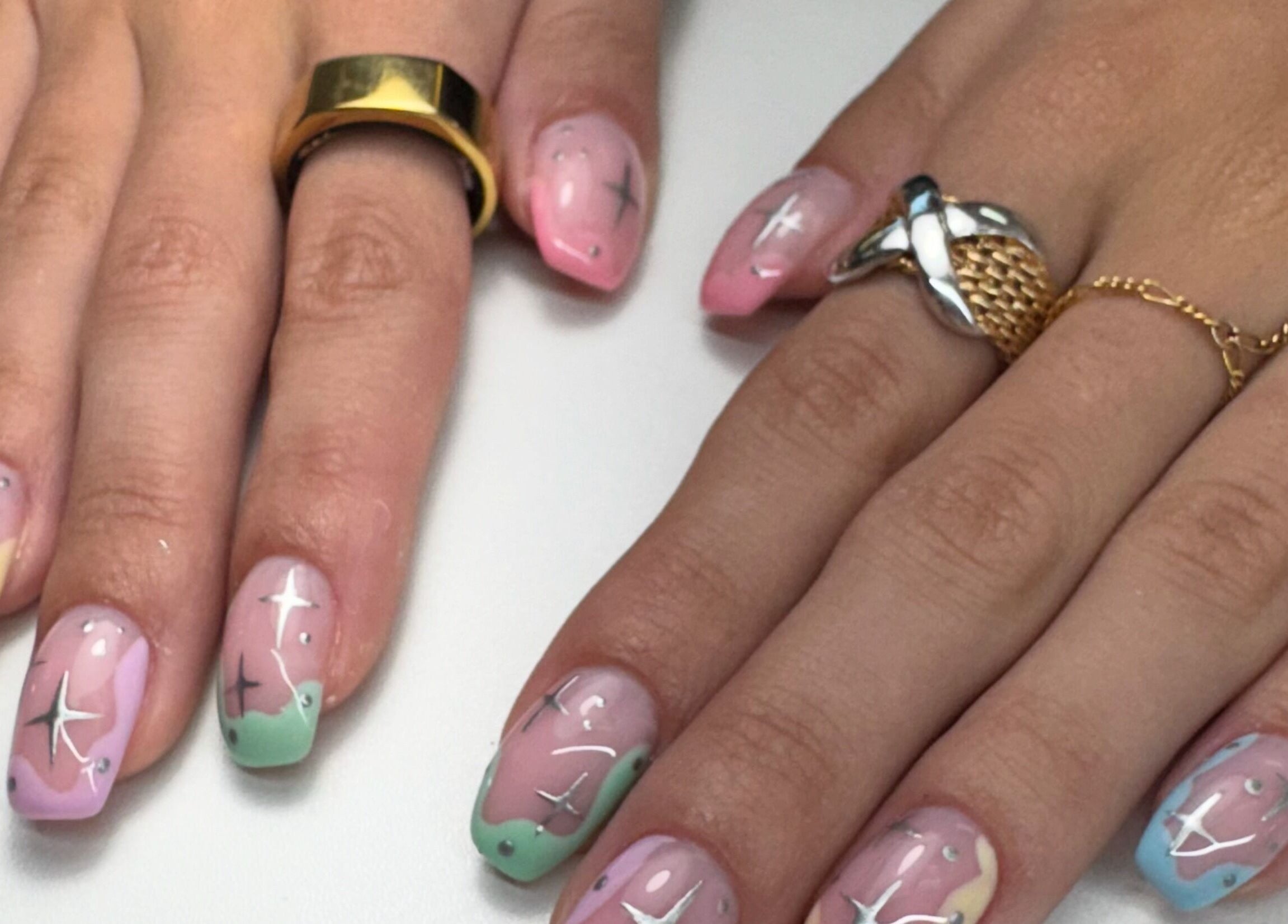 Celestial themed nail art at Alana Bee Nails, Margate, Florida. Featuring pastel colors and star designs.