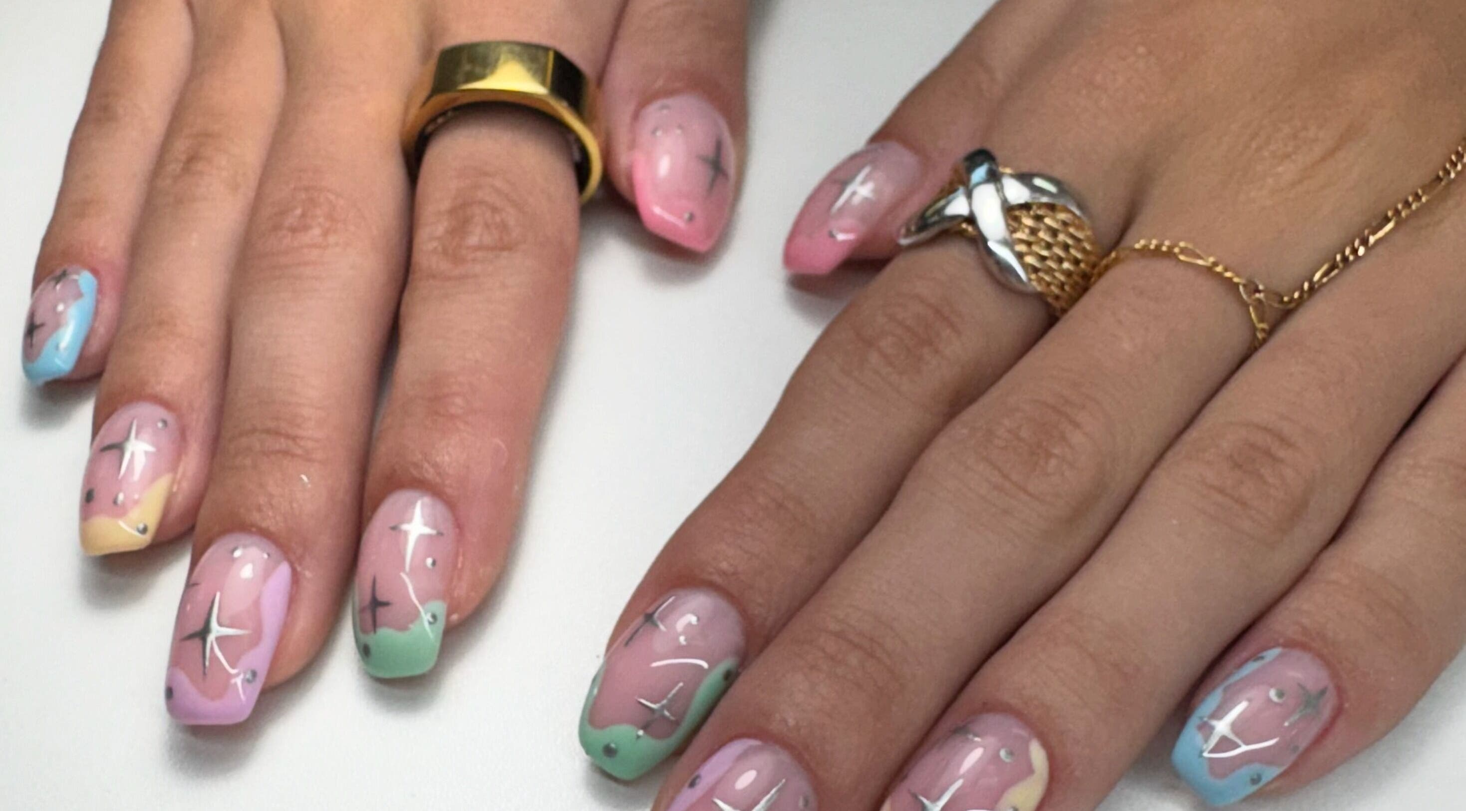 Celestial themed nail art at Alana Bee Nails, Margate, Florida. Featuring pastel colors and star designs.