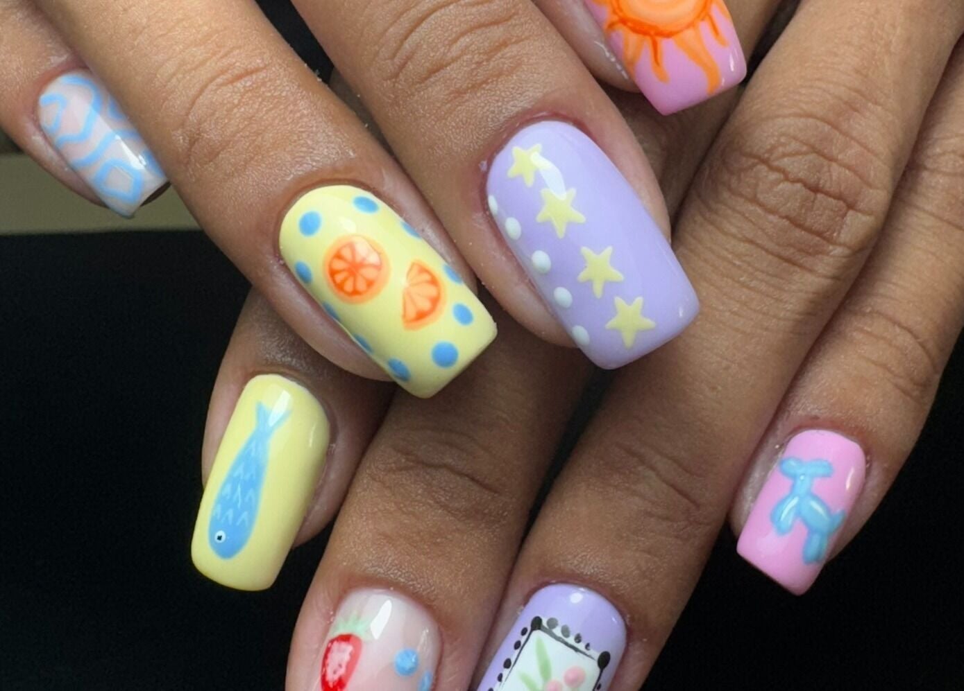 Bright, artistic nail art at Alana Bee Nails in Margate, Florida, US showcases vibrant summer designs.