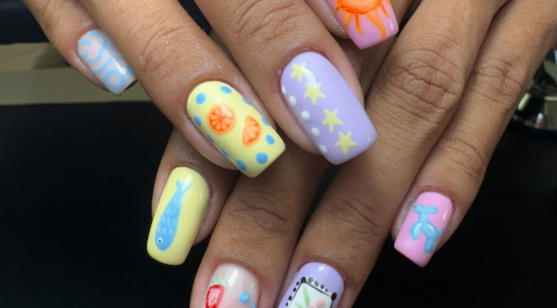 Bright, artistic nail art at Alana Bee Nails in Margate, Florida, US showcases vibrant summer designs.