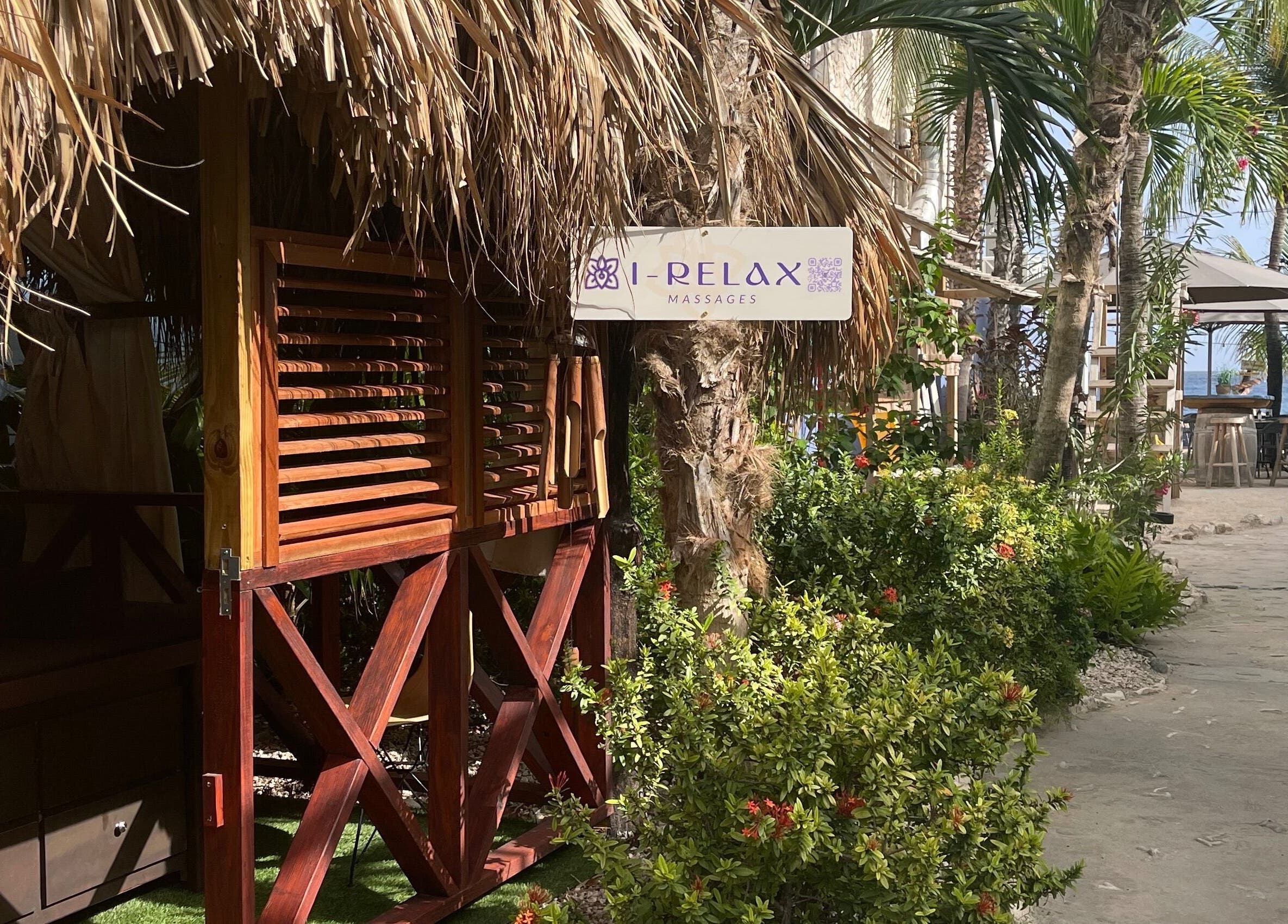 Relaxing view of I-Relax Massages in Willemstad, CW surrounded by lush greenery and sea view.