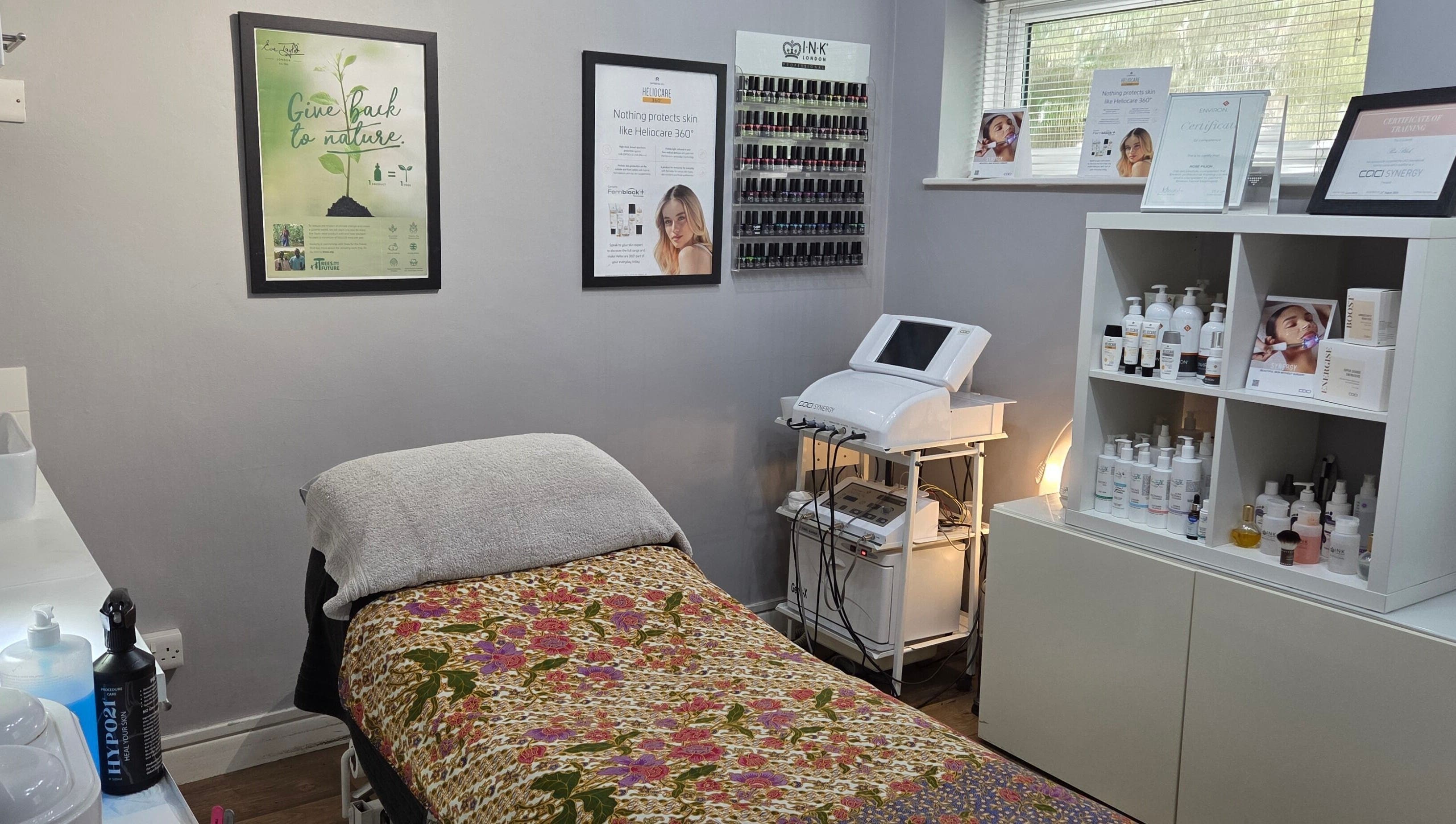Cozy treatment room at Reflection Skin & Beauty Clinic, Westbourne, England, GB with decorative bedding.