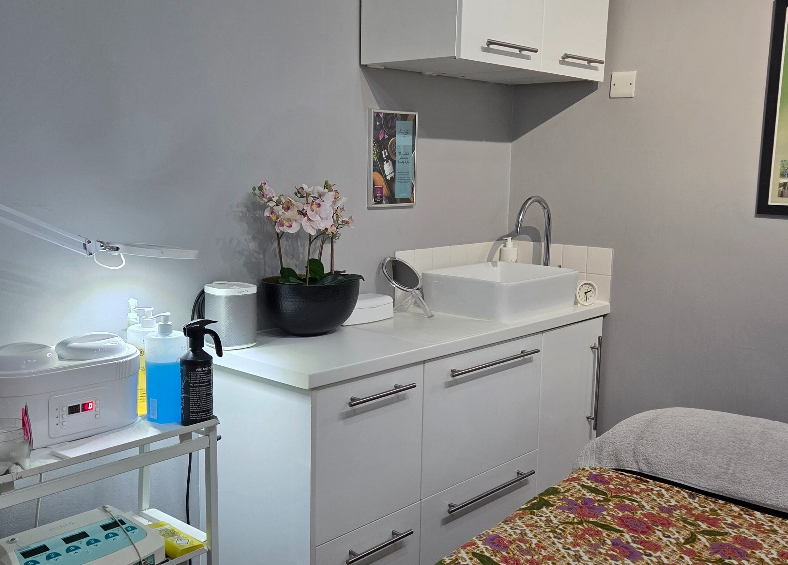 Relaxing treatment room at Reflection Skin & Beauty Clinic, Westbourne, England, GB with modern decor and equipment.