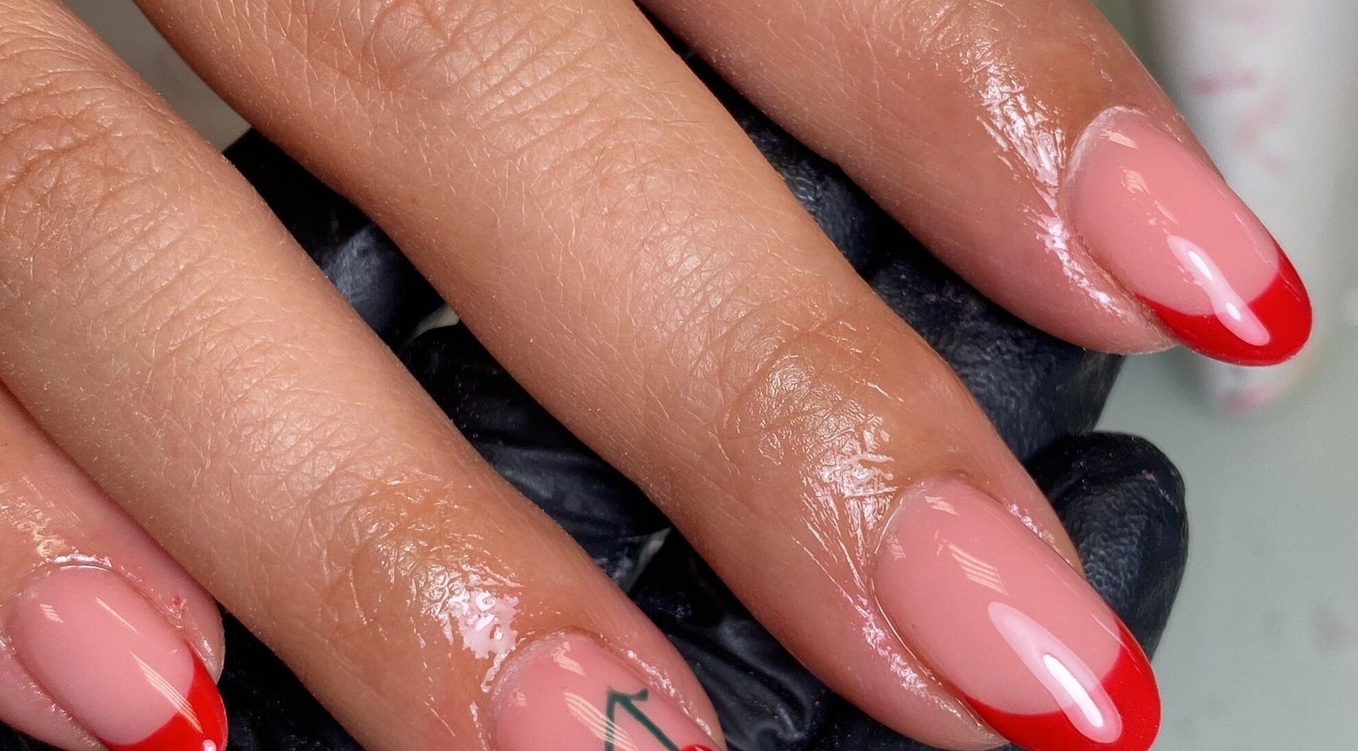 Elegant red-tipped nails at The Beauty Studio by Abbie, Delph, England, GB showcasing expert nail care.