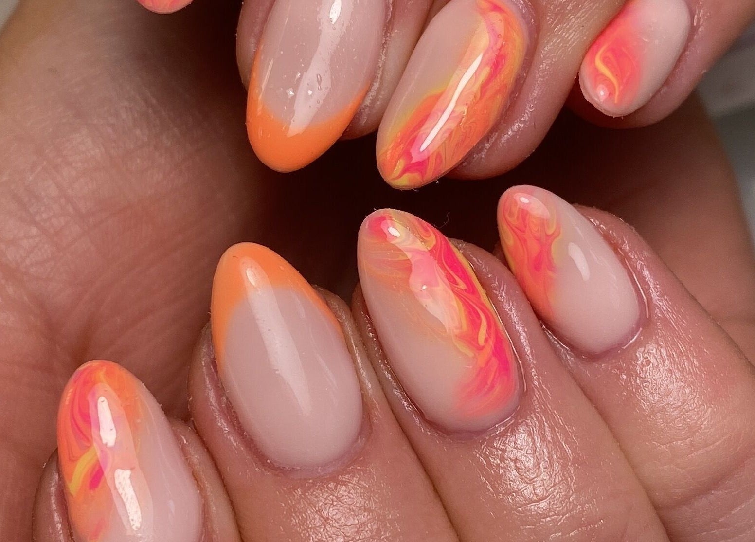 Vibrant orange and pink swirl nail art at The Beauty Studio by Abbie, Delph, England, GB.