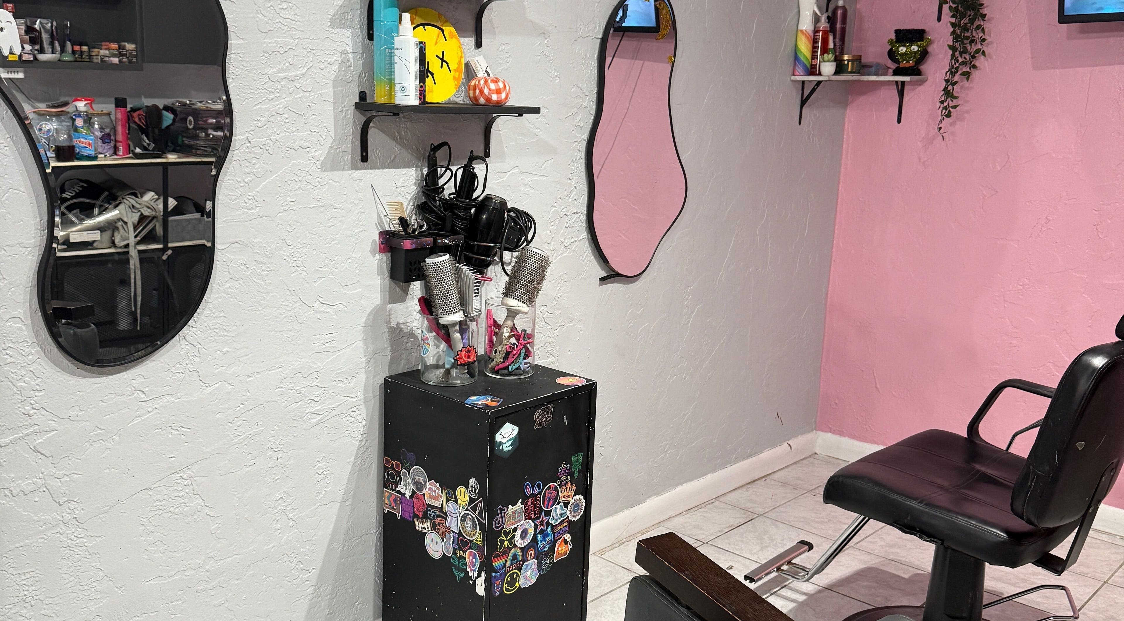 Studio 17 salon station with mirrors and styling tools in Cutler Bay, Florida, US.