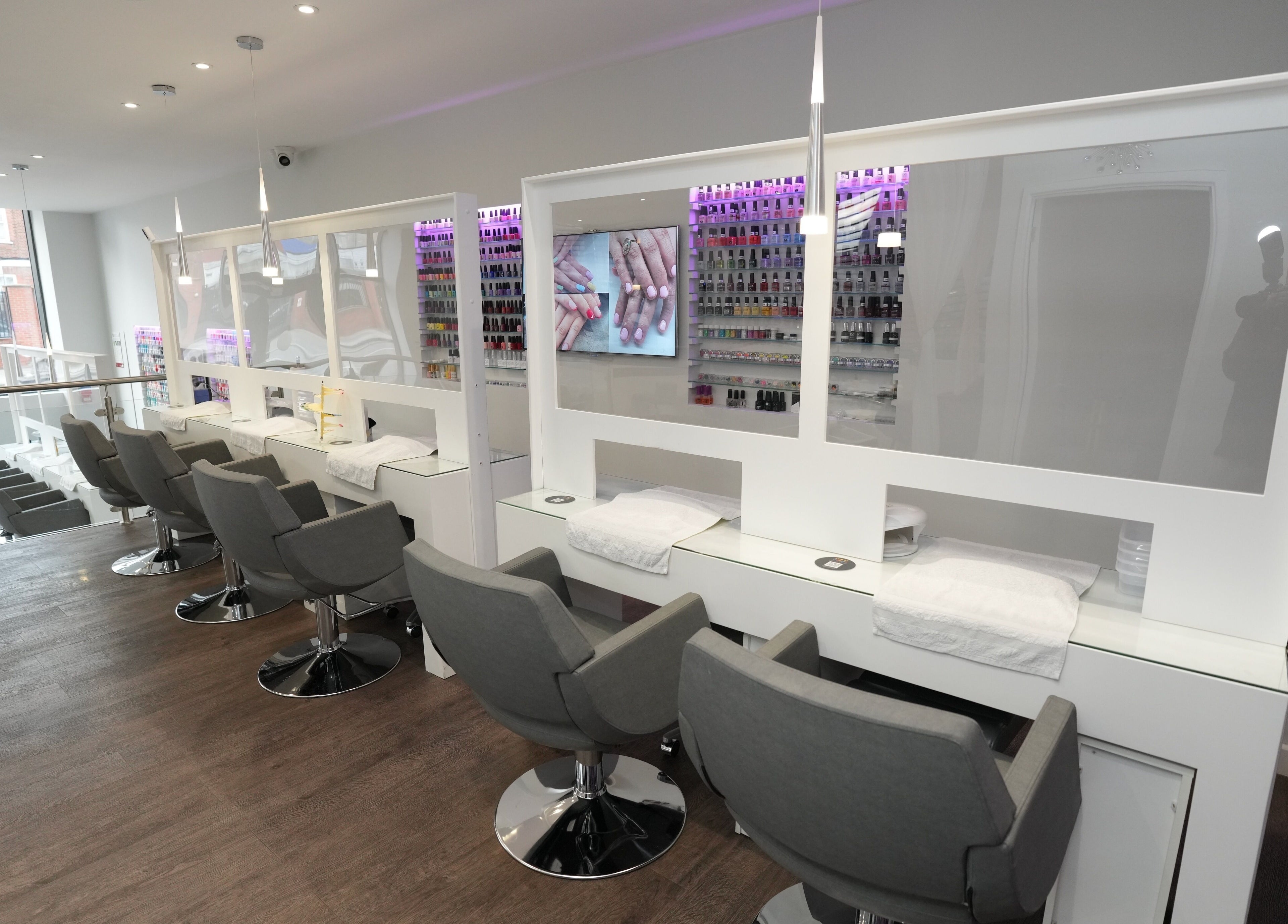 Modern nail station interior at Laska By Mira in Colindale, England, GB with chic decor and natural light.