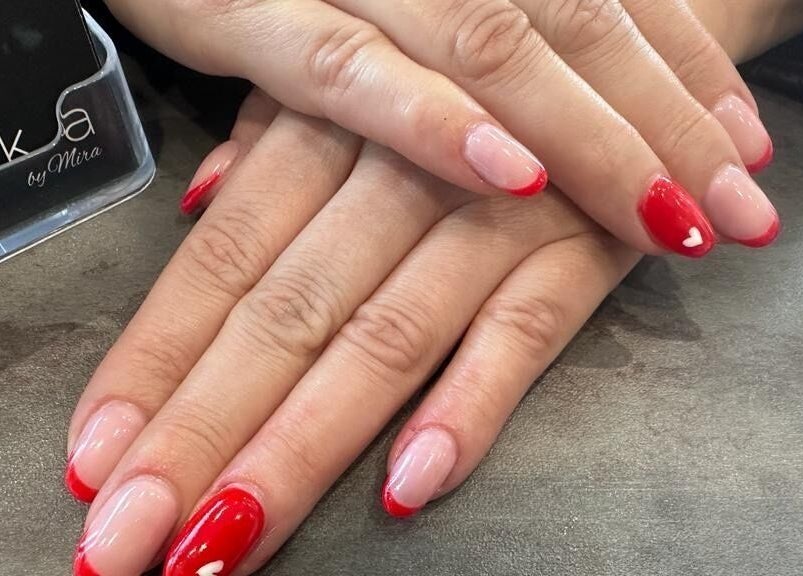 Elegant red and pink manicure at Laska By Mira, Colindale, England, GB showcasing creative nail art.