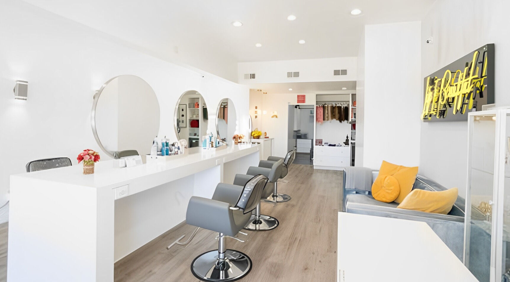 Chic interior of Brasilian Blow Dry Hair Salon in West Hollywood, California, US with stylish chairs and mirrors.