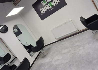 Interior of Salon Underground in Longridge, England, featuring modern black chairs and stylish decor.