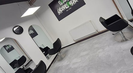 Interior of Salon Underground in Longridge, England, featuring modern black chairs and stylish decor.