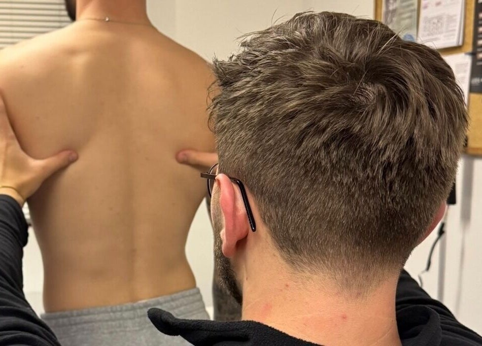 Therapist at Emerj Fit in Retford, England, GB provides back treatment for wellness and relief.