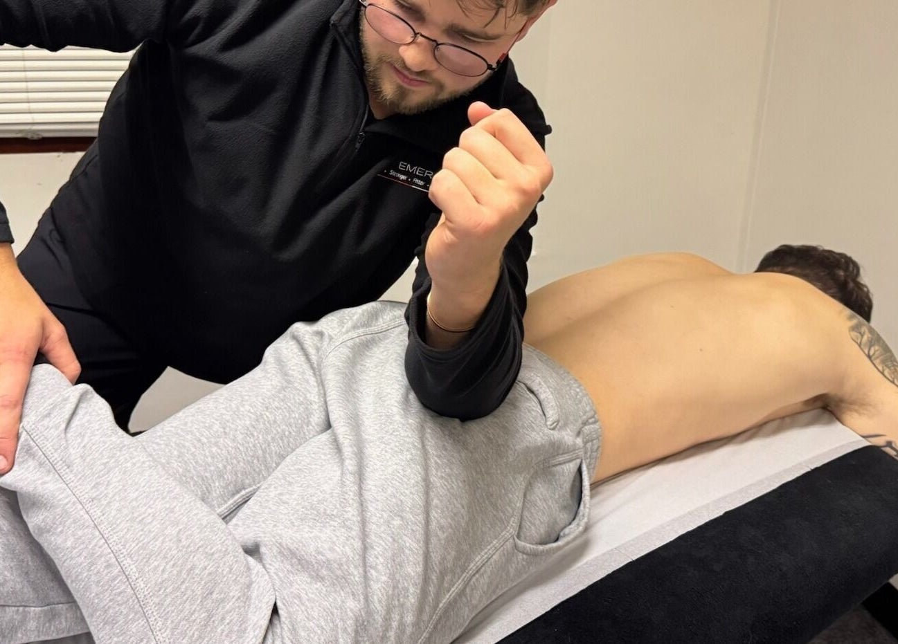 Therapist performs muscle therapy at Emerj Fit in Retford, England, GB.