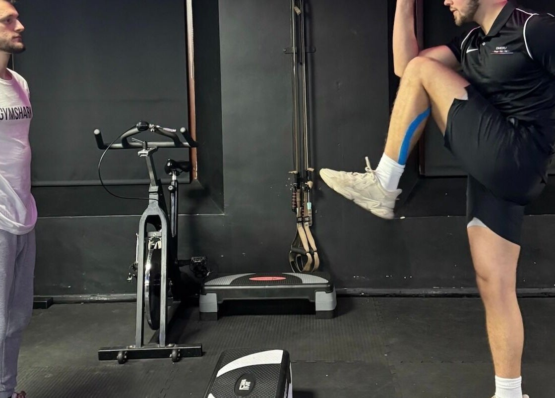 Trainer supervising a fitness session at Emerj Fit gym in Retford, England, GB.