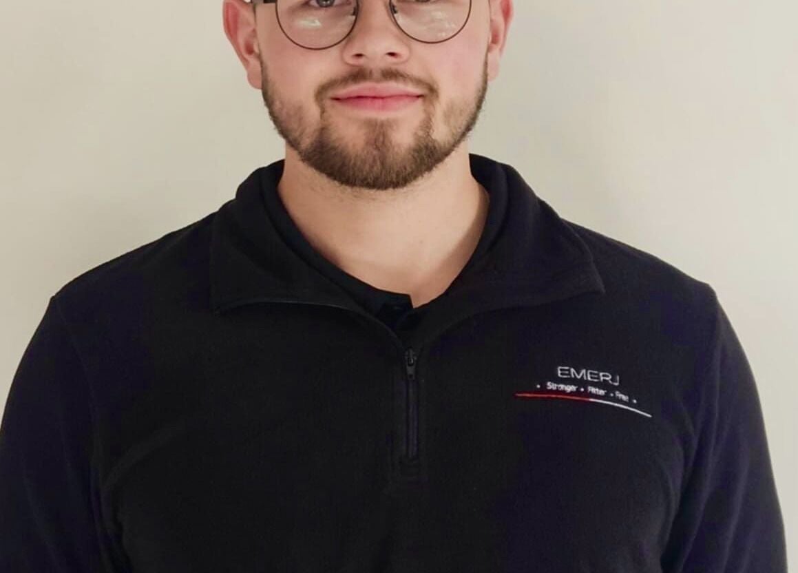 Emerj Fit team member in uniform at Retford, England, GB, showcasing a welcoming atmosphere.