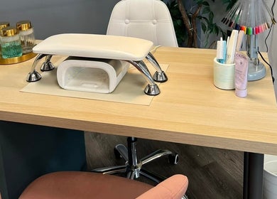 Manicure station at Atmillies in Scunthorpe, England, GB features a sleek table setup with nail tools.