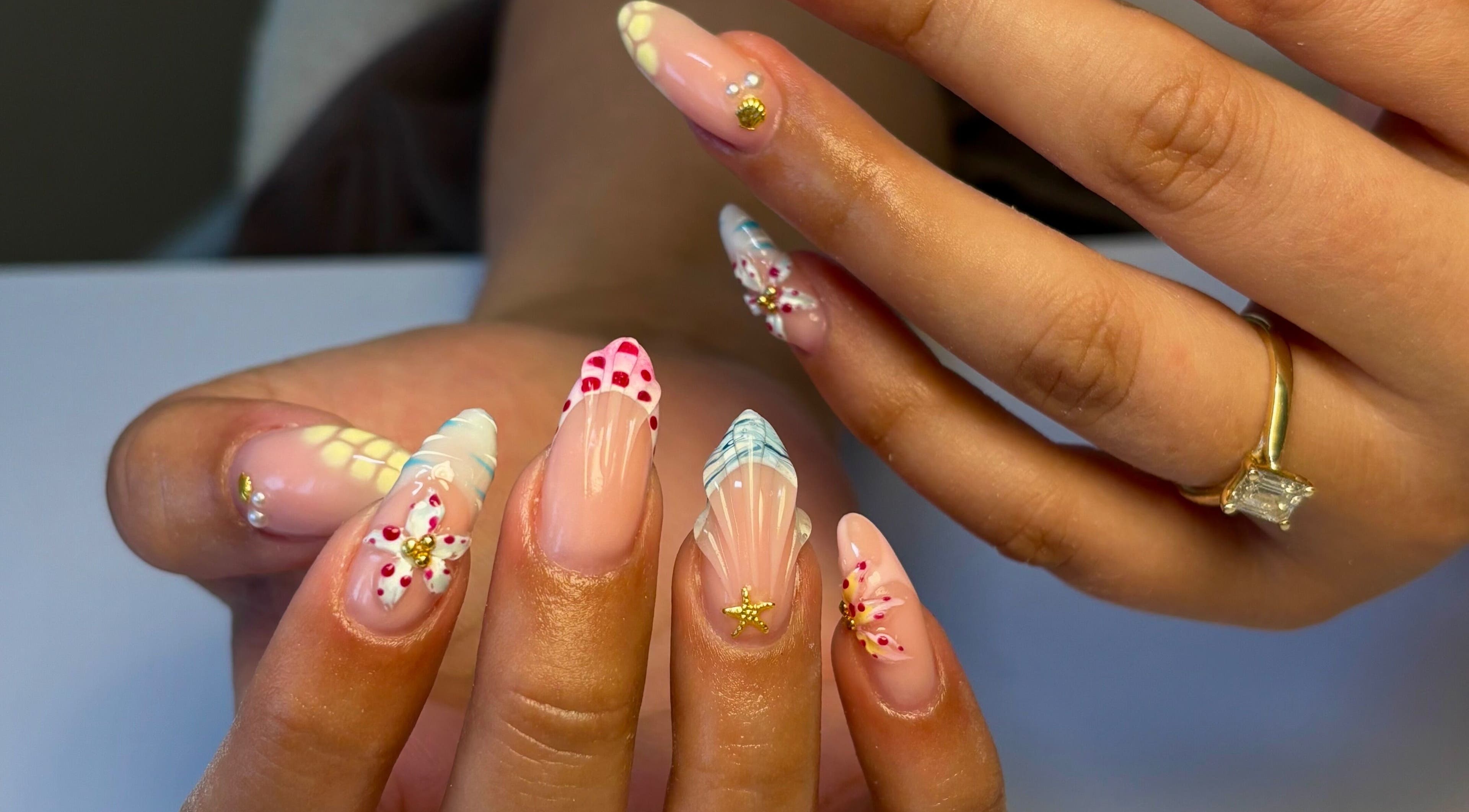 Intricate nail art design at Atmillies, Scunthorpe, England, GB showcasing detailed elegance.