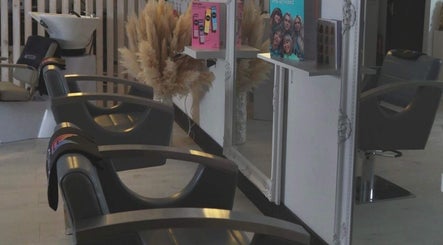 Stylish salon chairs and mirrors at The White Hair in Barnsley, England, GB.
