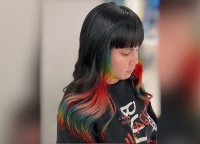 Colorful hair style at Cosmo Hair Salon in Melbourne, Victoria, AU showcasing vibrant multicolored tones.