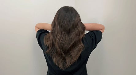 Elegant wavy hairstyle crafted at Cosmo Hair Salon, Melbourne, Victoria, AU.