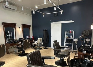 Sleek interior of HILLMEN HAIR STUDIO MASJID TANAH in Masjid Tanah, Malacca, MY, showcasing modern barber chairs.