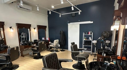 Sleek interior of HILLMEN HAIR STUDIO MASJID TANAH in Masjid Tanah, Malacca, MY, showcasing modern barber chairs.