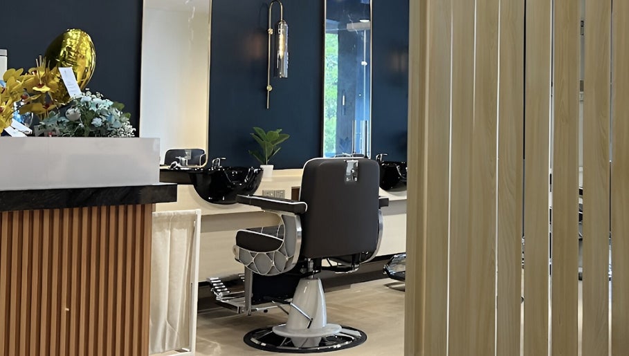 Elegant interior of HILLMEN HAIR STUDIO AYER KEROH, Ayer Keroh, Melaka, MY with stylish barber chair and decor.