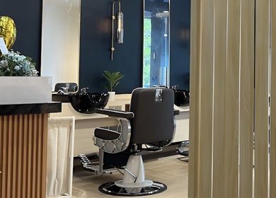Elegant interior of HILLMEN HAIR STUDIO AYER KEROH, Ayer Keroh, Melaka, MY with stylish barber chair and decor.