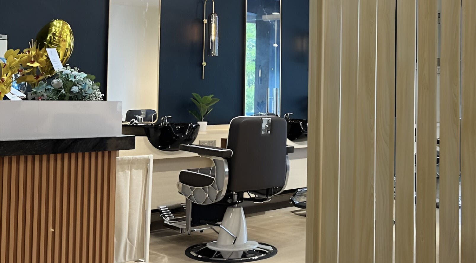 Elegant interior of HILLMEN HAIR STUDIO AYER KEROH, Ayer Keroh, Melaka, MY with stylish barber chair and decor.