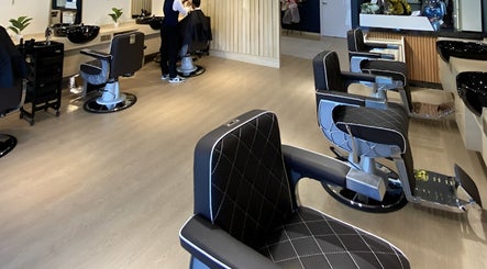 Modern interior of HILLMEN HAIR STUDIO AYER KEROH, featuring stylish barber chairs in Ayer Keroh, Melaka, MY.
