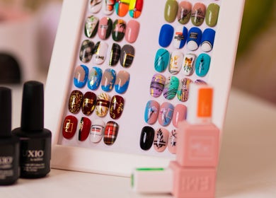 Colorful nail designs displayed at Isra Salih Beauty Lounge, الشارقة, إمارة الشارقةّ, AE.