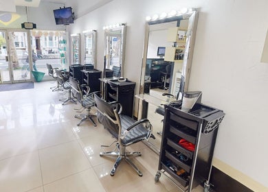 Modern styling chairs and mirrors at Da Silva Hair & Beauty in London, England, GB.