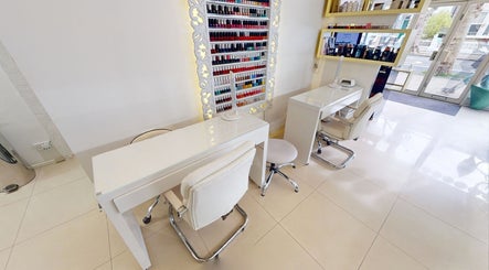Chic nail station at Da Silva Hair & Beauty, London, England, GB, featuring sleek decor and vibrant polish options.