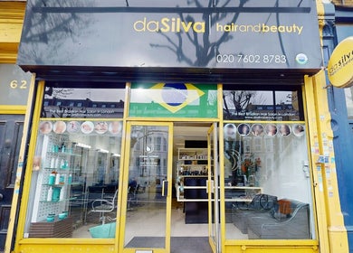Da Silva Hair & Beauty storefront with Brazilian flag in London, England, GB.