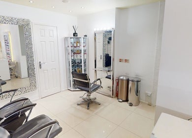 Elegant salon interior at Da Silva Hair & Beauty, London, England, GB, showcasing modern styling stations.