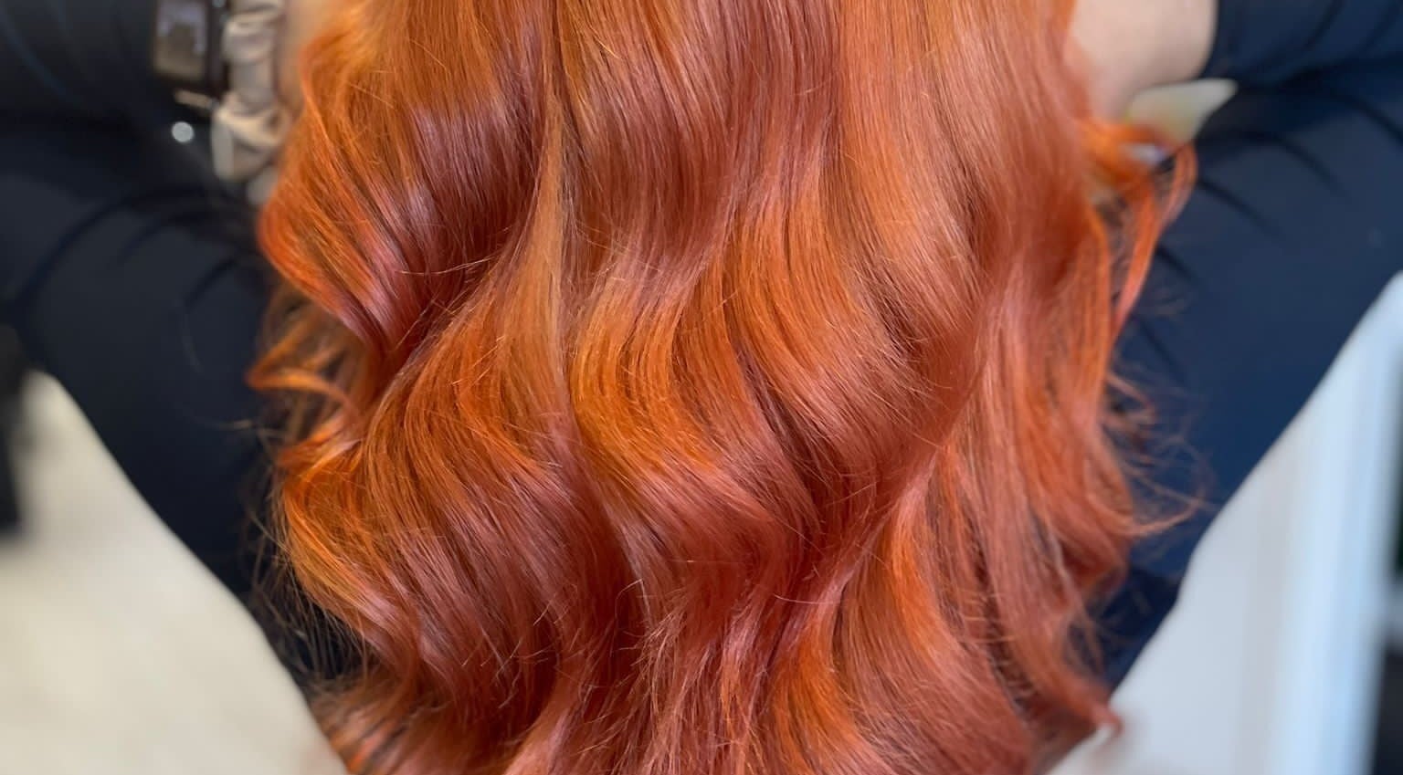 Vibrant red hair styled by Hair by Lyds in Pontypridd, Wales, GB. Perfect wavy finish adding elegant volume.