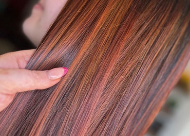 Vibrant hair color at Hair by Lyds, Pontypridd, Wales, GB showcasing sleek, glossy strands.