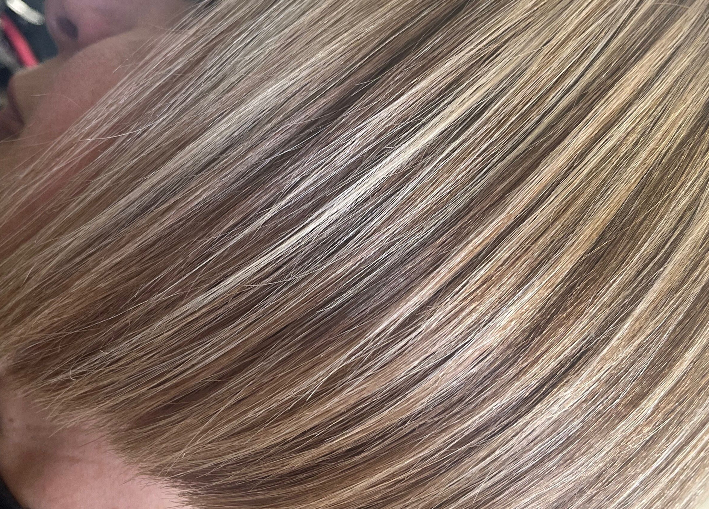Close-up of a sleek blonde bob hairstyle at Hair by Lyds, Pontypridd, Wales, GB.