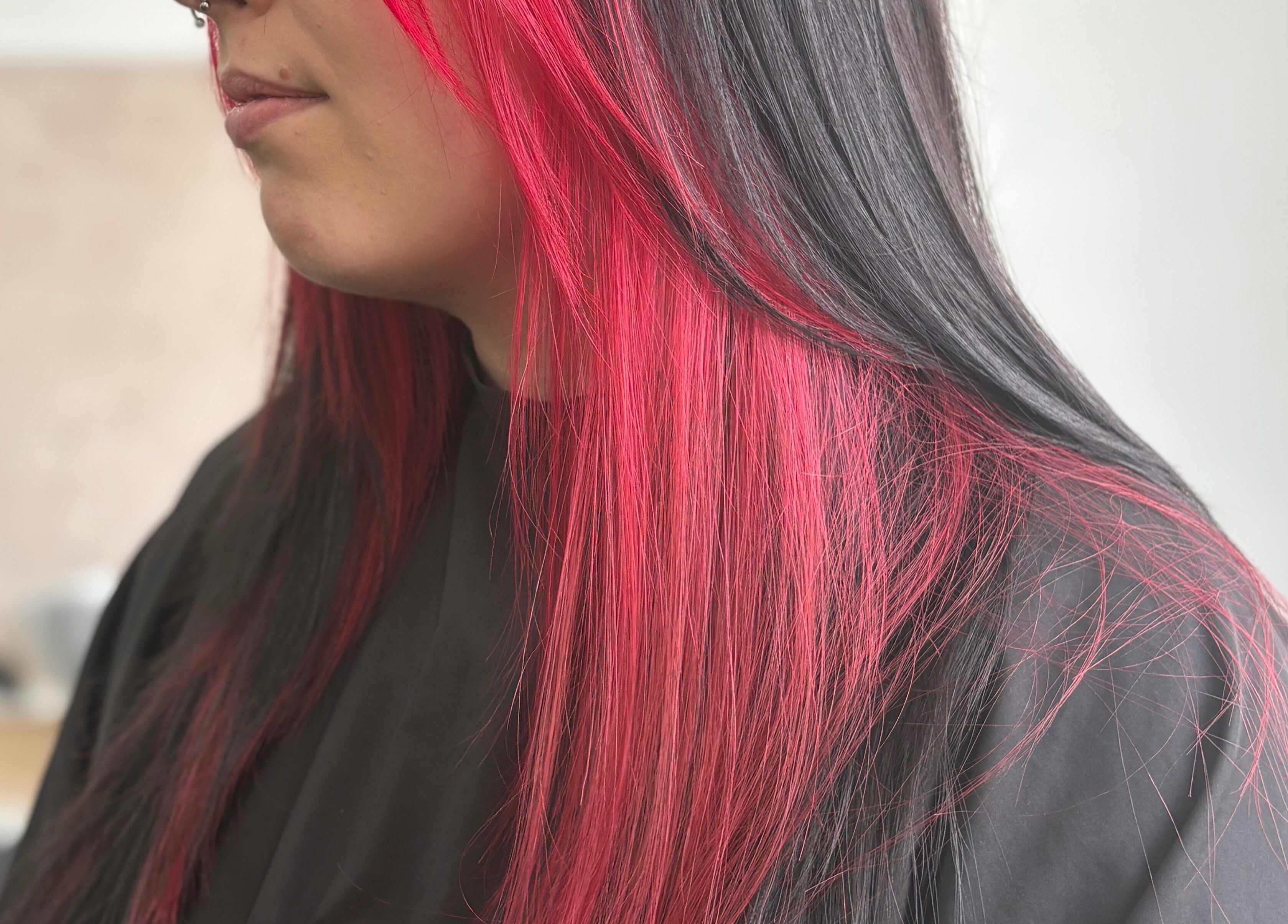 Bold red and black hair styled at Hair by Lyds, Pontypridd, Wales, GB, showcasing expert color technique.