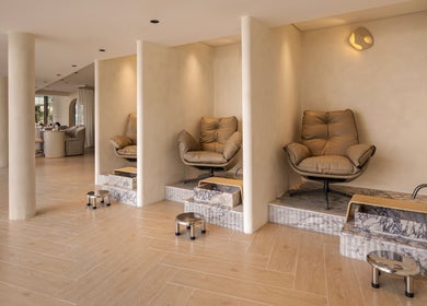 Luxurious pedicure stations at Casa Aire Wellness, Dubai, Dubai, AE, showcasing plush seating and marble decor.