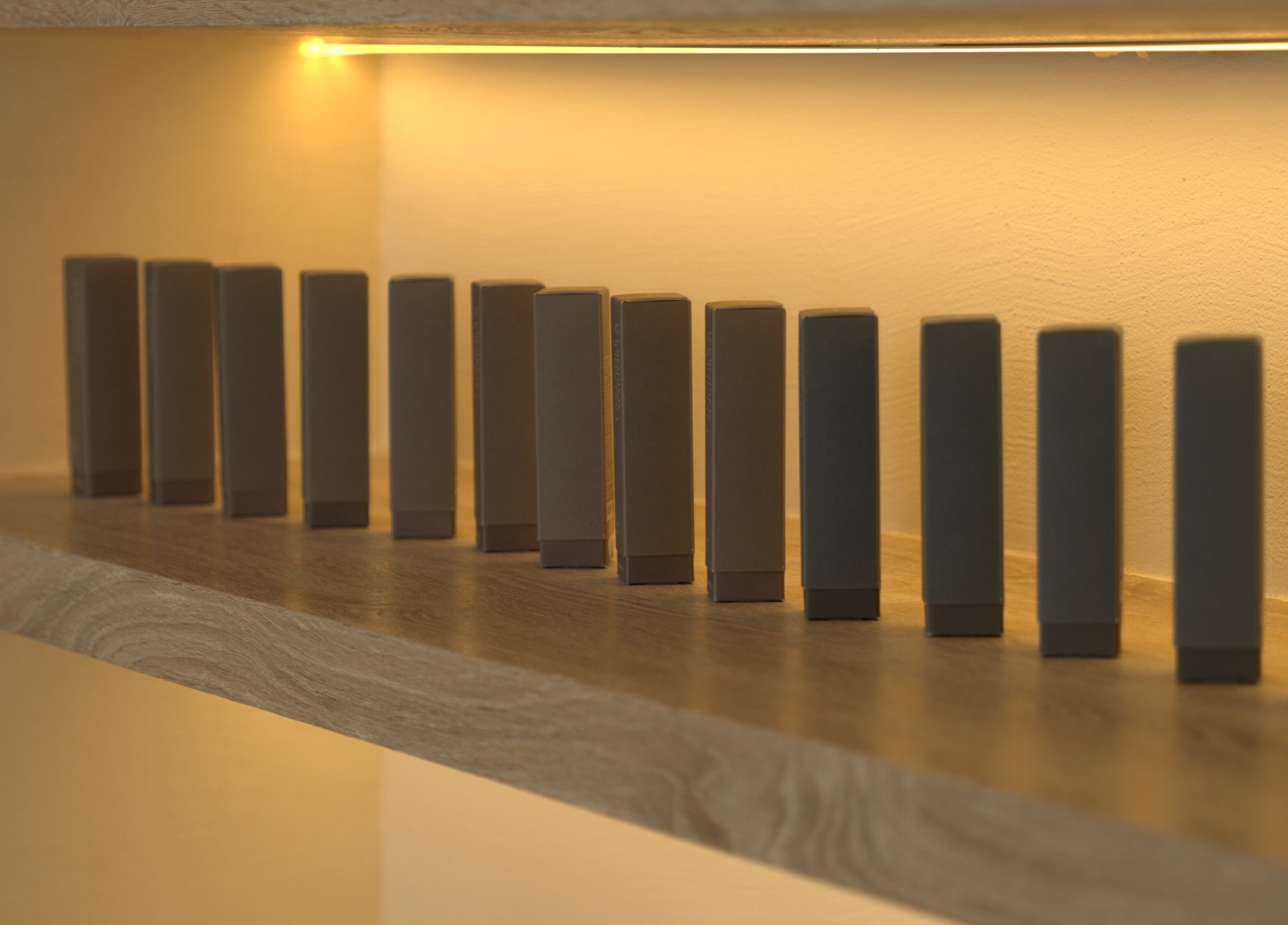 Elegant brown boxes on a lit shelf at Aire MD by Casa Aire Wellness, Dubai, Dubai, AE.