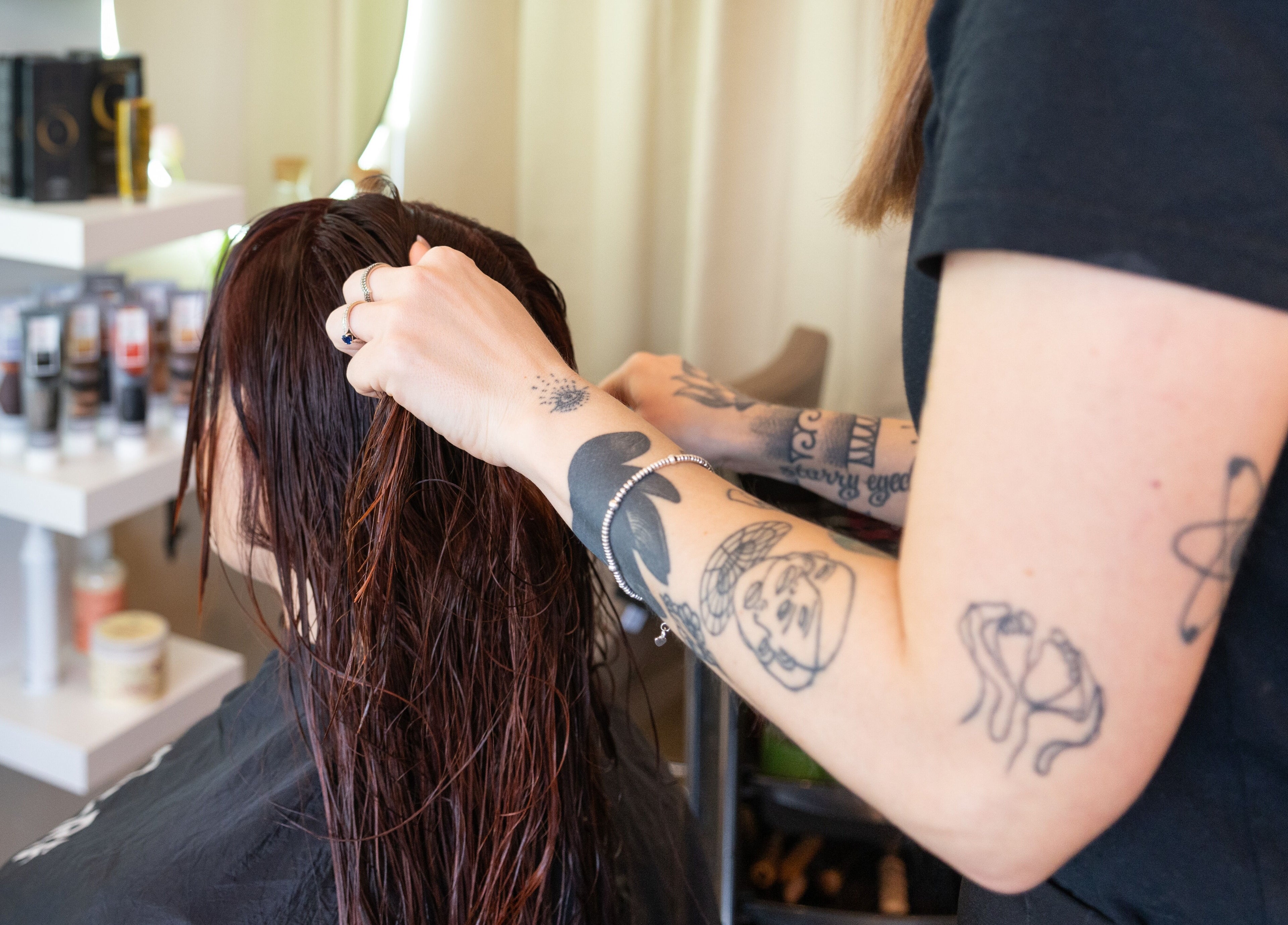 Hairstylist working on wet hair at Claudia Hairstylist in London, England, GB.