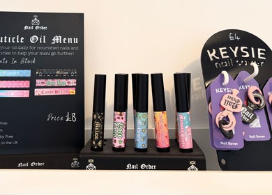 The Nail Nook in Horley, England, GB showcases a vibrant array of cuticle oils and nail savers.